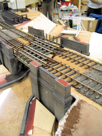 Canal bridge under construction.  A lifting bridge is also under construction at the rear of the layout and the water is yet to be coloured