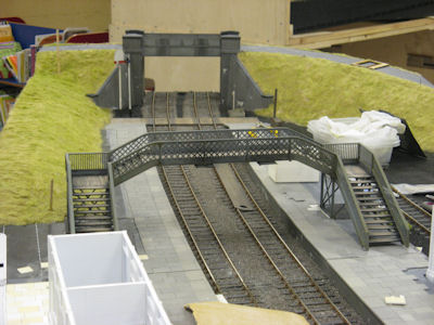 Initial colouring applied to the grass and footbridge